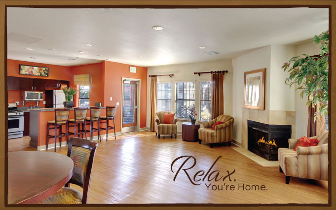 Living room with wood-style flooring, designer lighting, fireplace, lounge seating and bar area